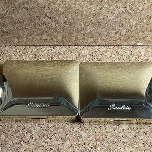 Set of four palettes: Guerlain, Laura Mercier, and MAC